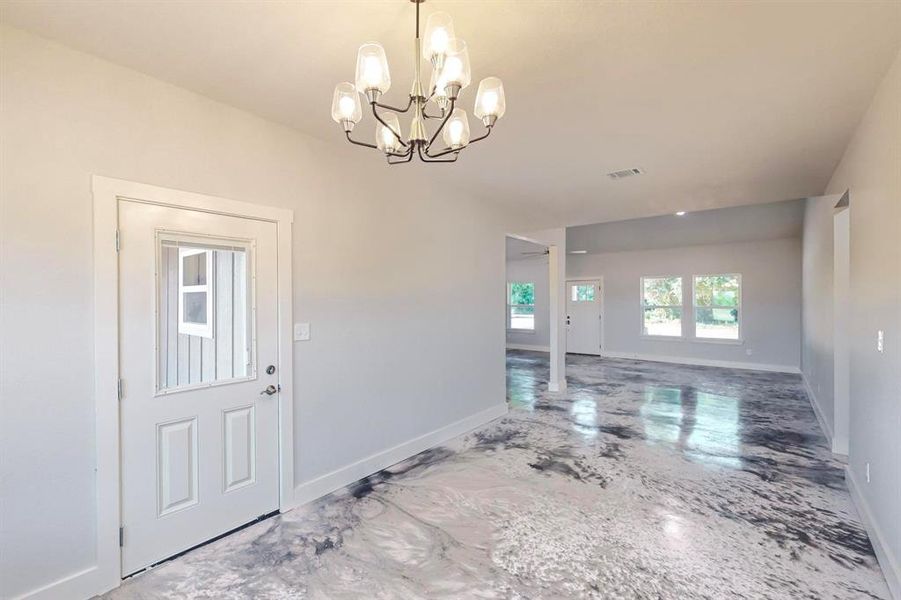 Foyer entrance with a chandelier