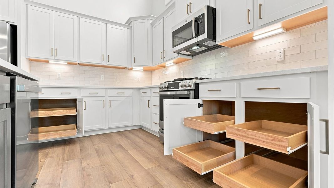Accomplished layout with a first-class kitchen in this select community by DRB Homes