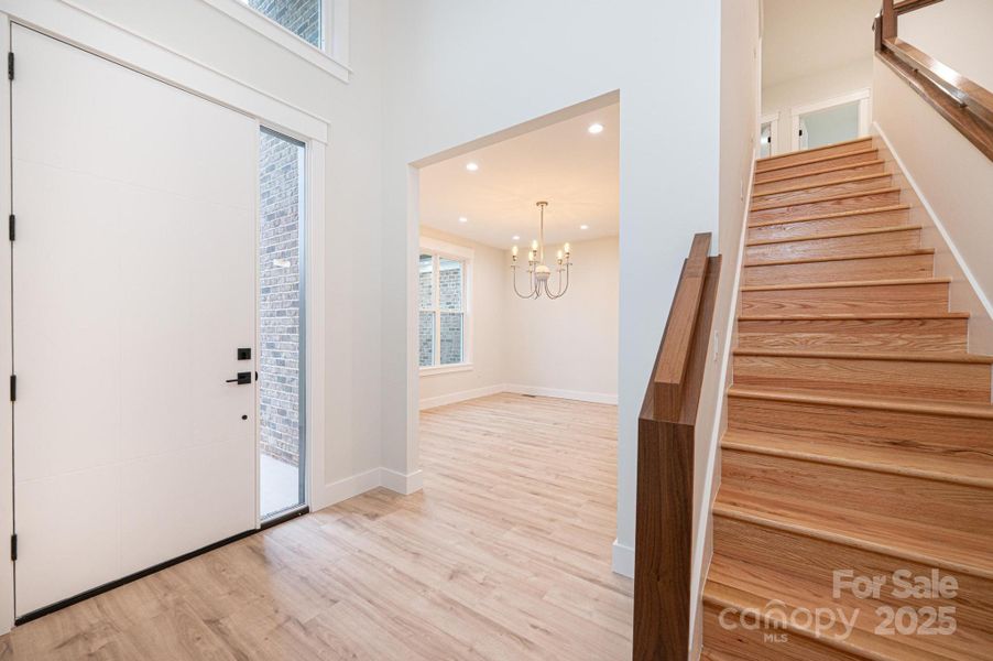 Front Entrance Foyer with Large Sidelight....View of Formal Dining and Stairway Upstairs... Front Entrance Foyer with Large Sidelight....View of Formal Dining and Stairway Upstairs...