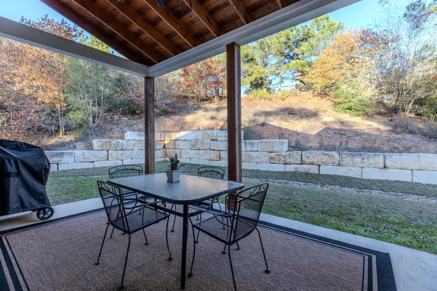 View of patio featuring area for grilling and outdoor dining space