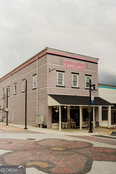 Front exterior of a new home in Ponderosa Farms Manor, Gainesville, GA, highlighting curb appeal (Image 32).