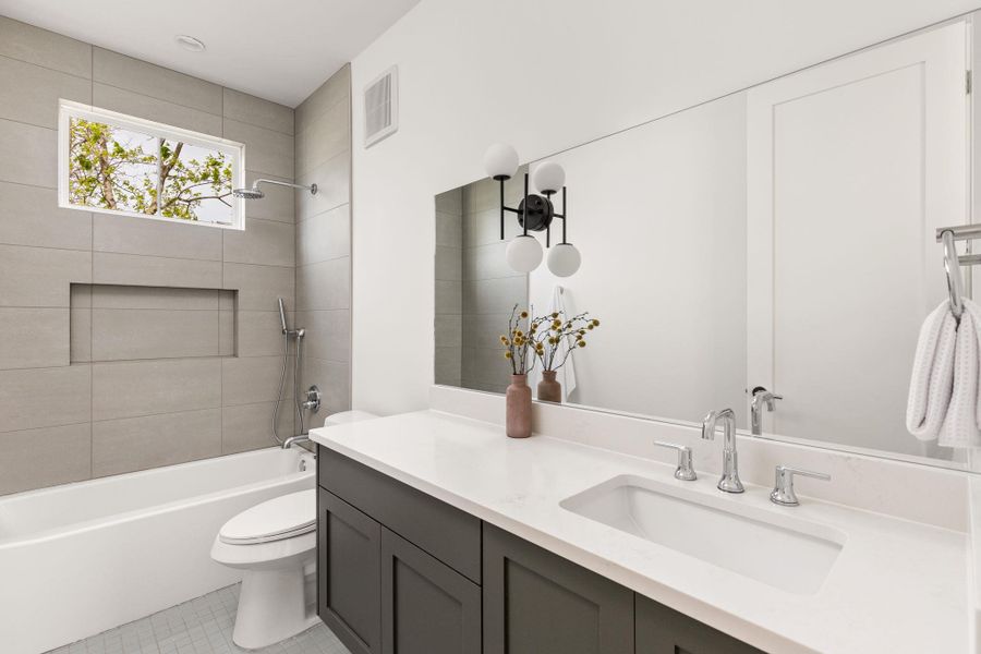 Bathroom featuring vanity and shower combination Bathroom featuring vanity and shower combination