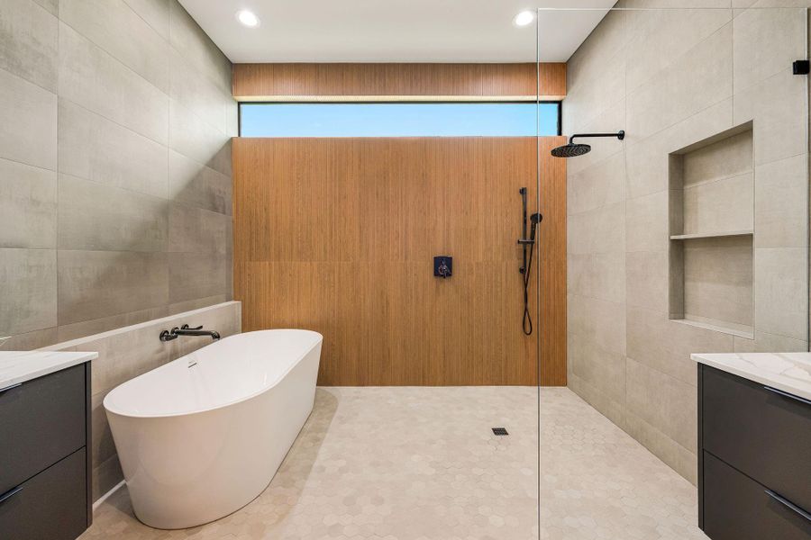 [WET ROOM] A spectacular wet room serves as the centerpiece of the primary bath, featuring a freestanding soaking tub seamlessly paired with an oversized walk-in shower for a true resort-inspired experience.