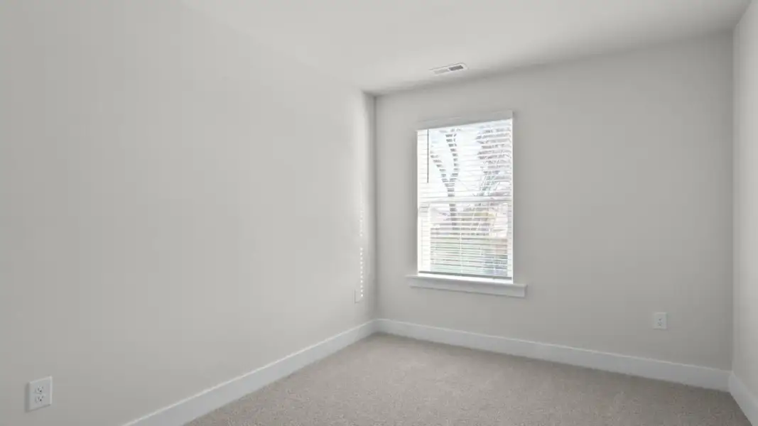 Spacious, unfurnished interior of a new home in The Townes at Cedar Hill Landing, Navassa (Image 23).