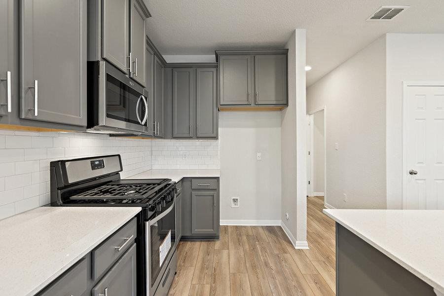 Photos are of a completed model of the same floor plan and are for illustrative purposes only. Actual home is under construction and design selections, materials, and features may differ. Confirm final specifications with the New Home Consultant.