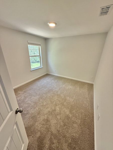 Spacious, unfurnished interior of a new home in Stone Fort Meadows, Manchester (Image 11).