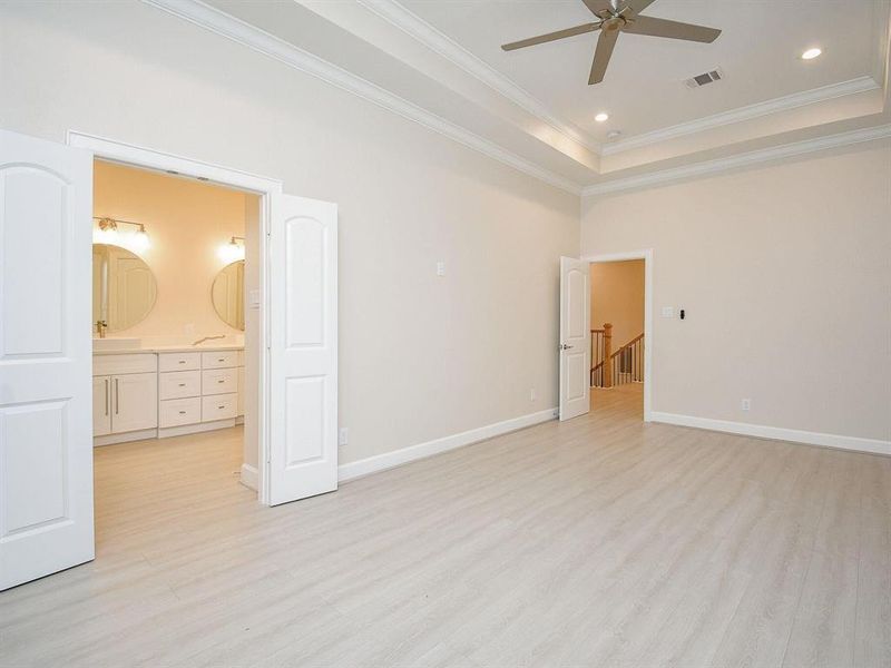 All bedrooms have tray ceilings and ceiling fans.