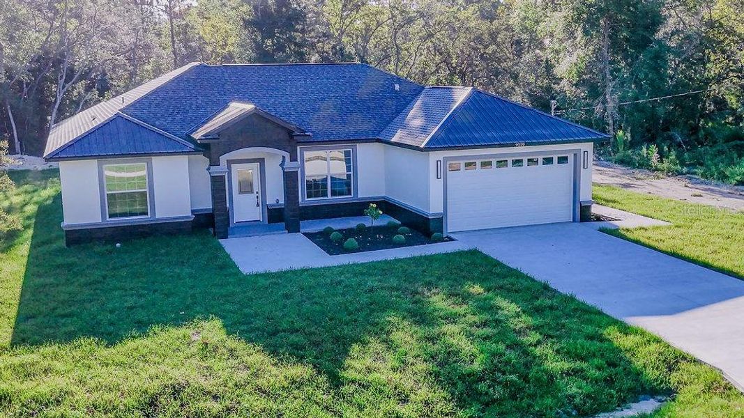 Front exterior of a new home in , Dunnellon, FL, highlighting curb appeal (Image 26). Front exterior of a new home in , Dunnellon, FL, highlighting curb appeal (Image 26).