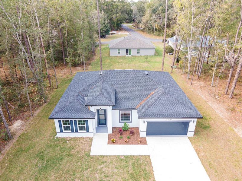 Front exterior of a new home in , Citrus Springs, FL, highlighting curb appeal (Image 20).
