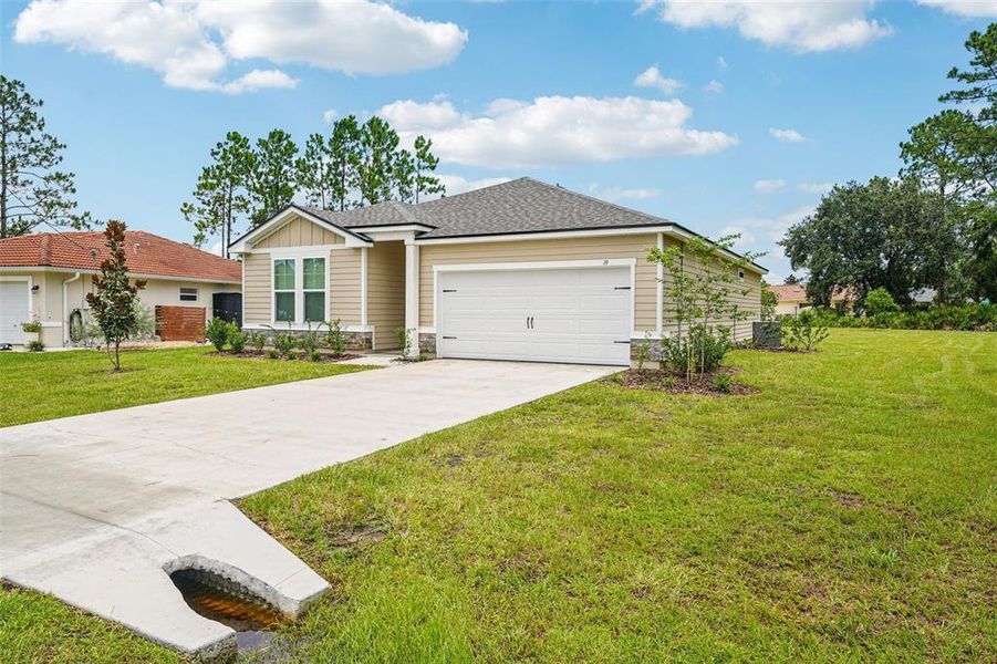 Front exterior of a new home in , Palm Coast, FL, highlighting curb appeal (Image 2).