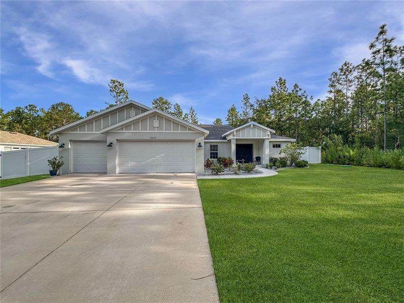 Front exterior of a new home in , Weeki Wachee, FL, highlighting curb appeal (Image 26).