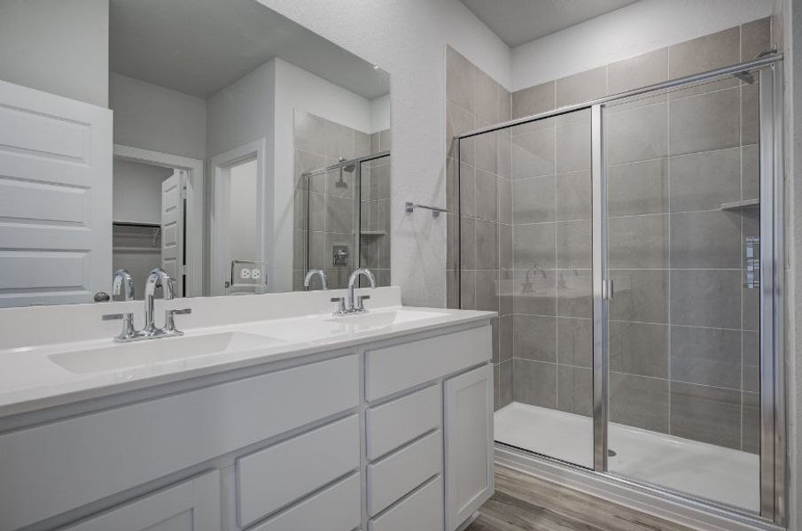 A bathroom with a glass shower.