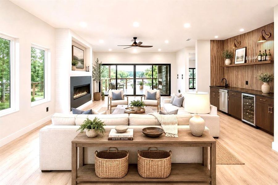 Virtually staged-Expansive living area featuring light wood-finish flooring and numerous recessed lights Virtually staged-Expansive living area featuring light wood-finish flooring and numerous recessed lights