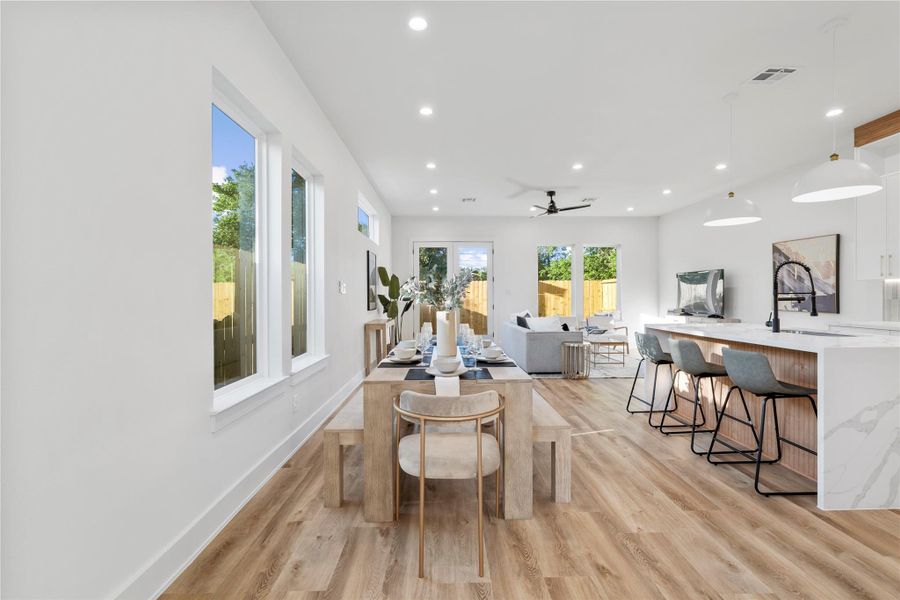 A welcoming entryway featuring a modern wood and glass front door, allowing natural light to stream into the home. A welcoming entryway featuring a modern wood and glass front door, allowing natural light to stream into the home.