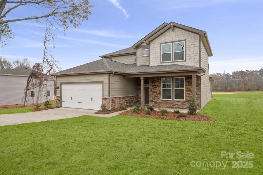 Front exterior of a new home in Running Creek, Locust, NC, highlighting curb appeal (Image 5). Front exterior of a new home in Running Creek, Locust, NC, highlighting curb appeal (Image 5).