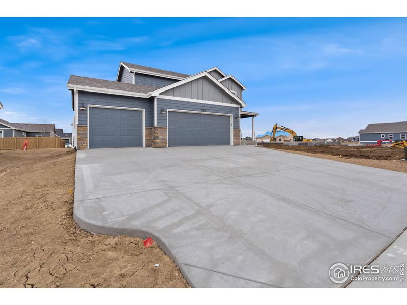 Front exterior of a new home in , Wellington, CO, highlighting curb appeal (Image 20).