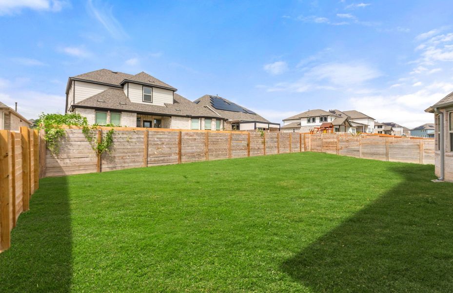 Exterior details and patio area of a home in Bluffview Reserve, Leander (Image 28).