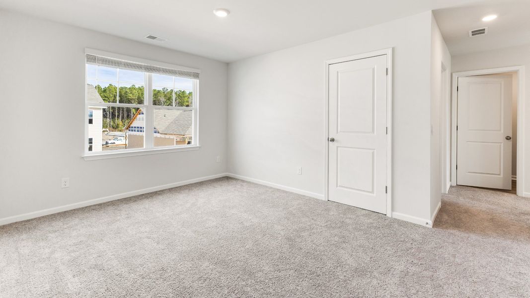 Representative unfurnished interior of a home built from the HAYDEN by D.R. Horton in Sidbury Station, Castle Hayne (Image 29).