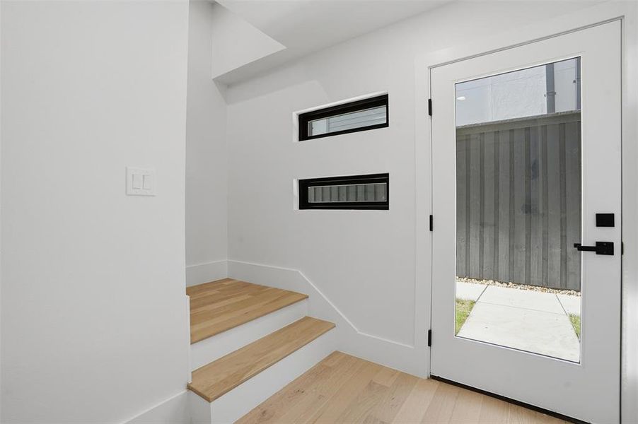 Entry with engineered oak hardwood flooring & tons of natural light!