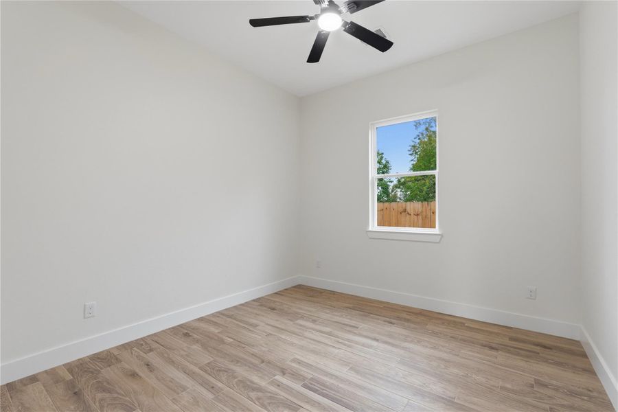 Bedroom 4 offers a ceiling fan and a roomy closet, providing both comfort and convenience.