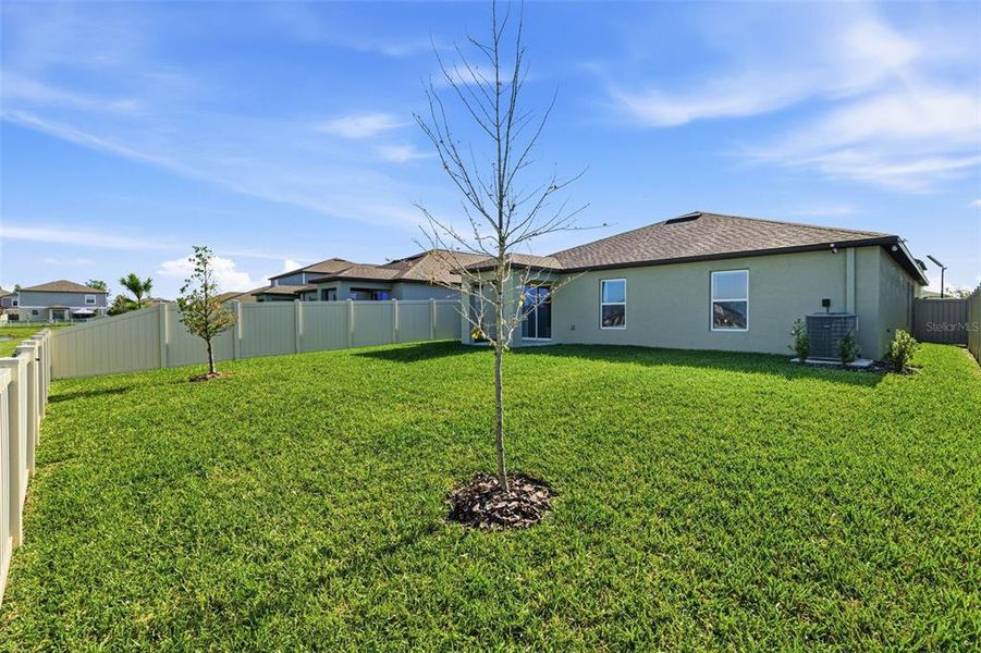 Exterior details and patio area of a home in North Park Isle, Plant City (Image 26).