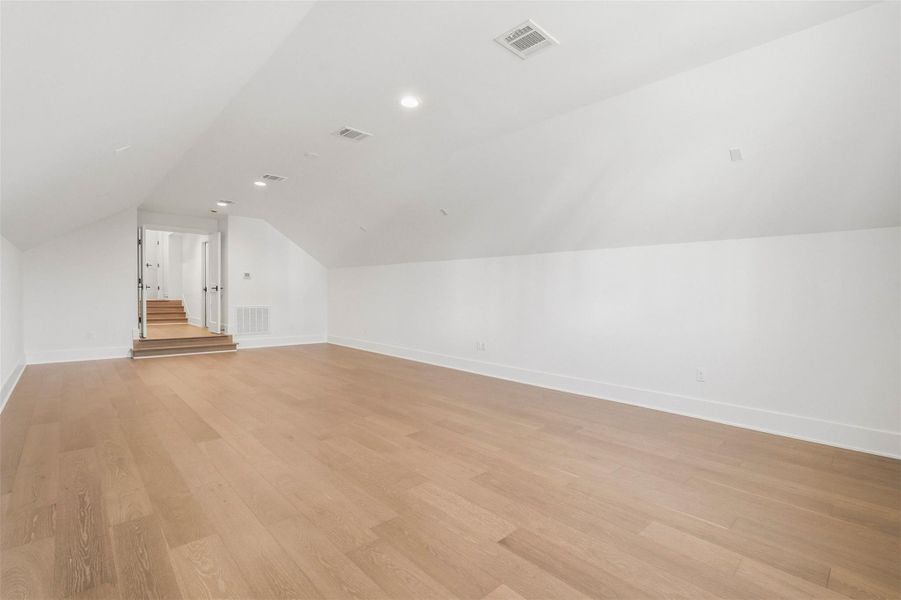 Through two sets of double French doors, this exceptional media room unfolds, offering versatile space that can serve as a home gym, a dedicated office, or a second game room on the second floor. Limitless possibilities. Through two sets of double French doors, this exceptional media room unfolds, offering versatile space that can serve as a home gym, a dedicated office, or a second game room on the second floor. Limitless possibilities.