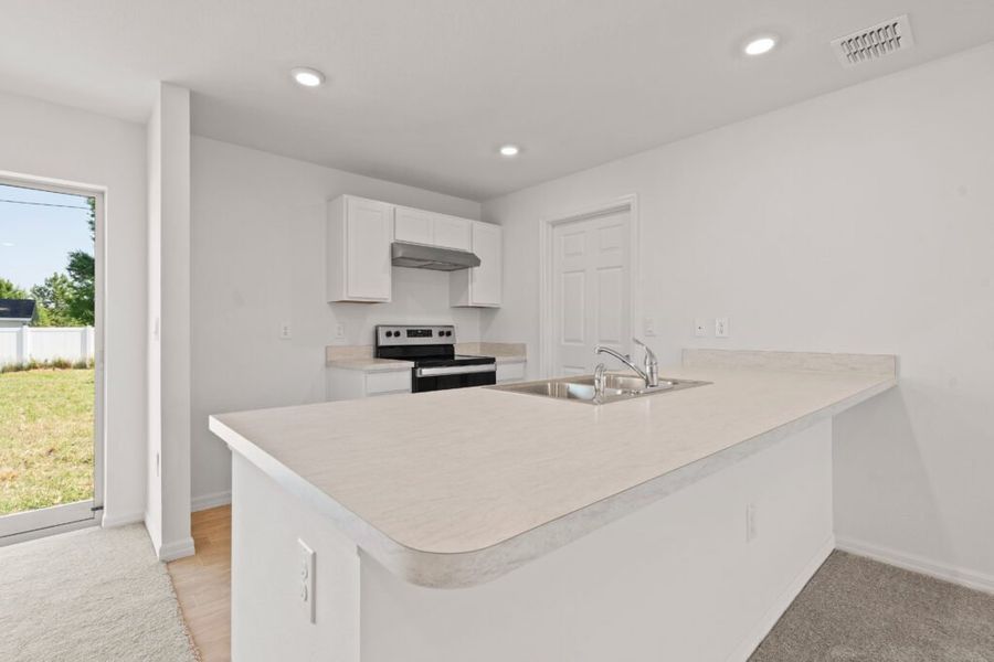 Representative furnished interior of a home built from the Phoenix by Holiday Builders in Poinciana, Poinciana (Image 4). Representative furnished interior of a home built from the Phoenix by Holiday Builders in Poinciana, Poinciana (Image 4).