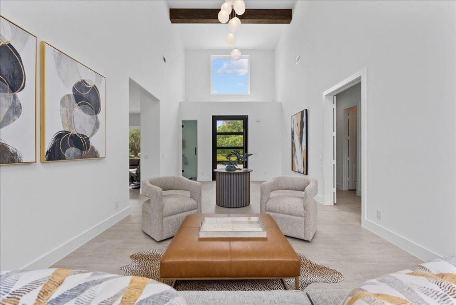 A massive wood beam and designer imported Italian lighting anchor the high-volume ceilings, creating a sophisticated entry.