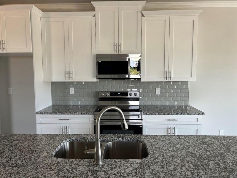 Furnished interior view inside a new home in Towns at Enclave, Lawrenceville (Image 6). Furnished interior view inside a new home in Towns at Enclave, Lawrenceville (Image 6).