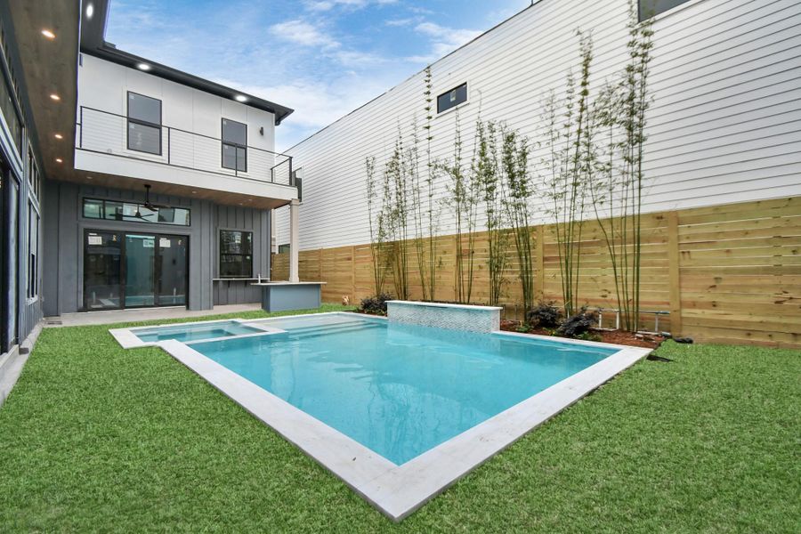 Beautiful heated pool/spa surrounded by turf (to be installed). Enjoy outdoor living with personal kitchen. Beautiful heated pool/spa surrounded by turf (to be installed). Enjoy outdoor living with personal kitchen.