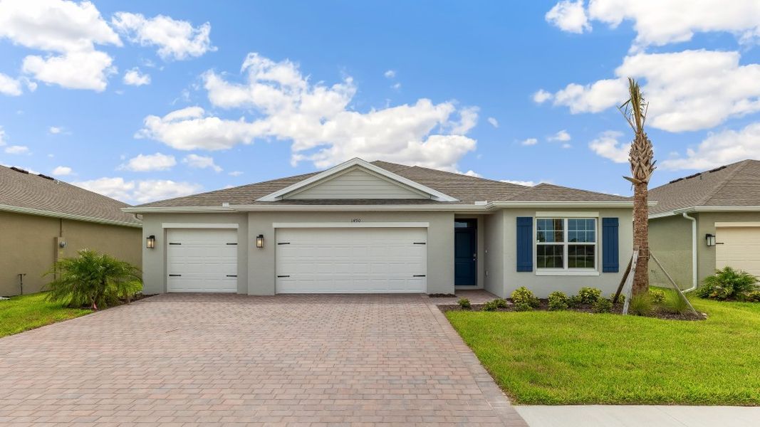 Front exterior of a new home in Cape Coral Water & Sewer, Cape Coral, FL, highlighting curb appeal (Image 1). Front exterior of a new home in Cape Coral Water & Sewer, Cape Coral, FL, highlighting curb appeal (Image 1).