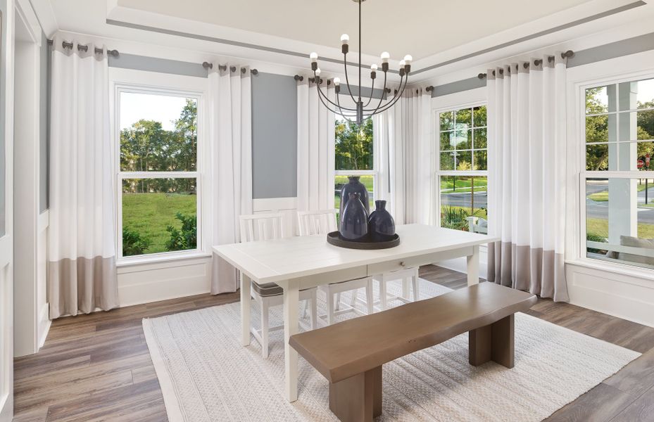 An elegant dining room with bright lighting.