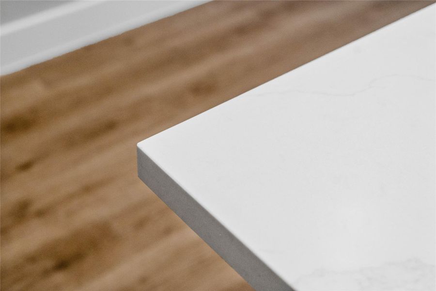 Kitchen countertops - Iced White Quartz - a clean, modern edge profile.