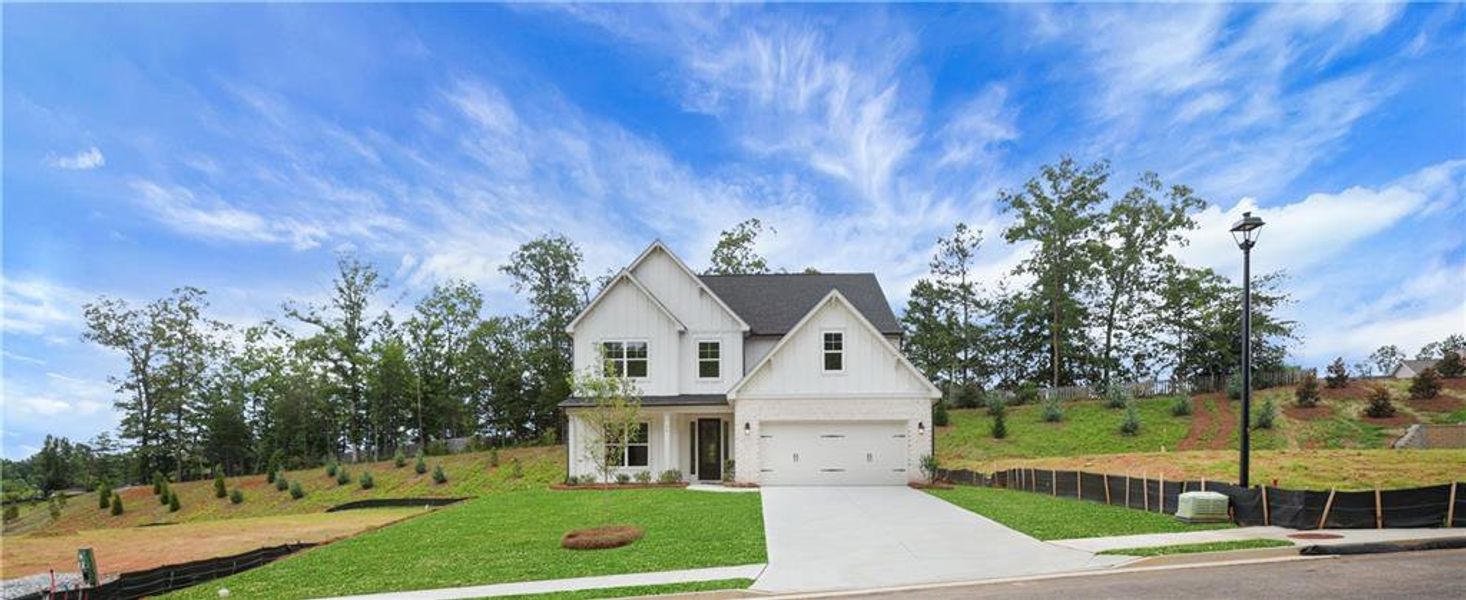 Front exterior of a new home in Arbor West, Dawsonville, GA, highlighting curb appeal (Image 25).