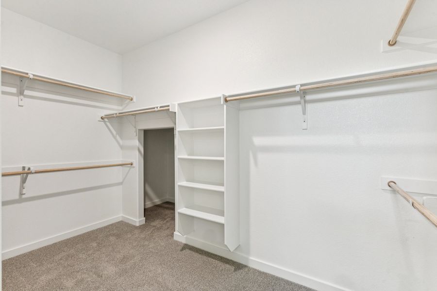 Primary Closet in the Wimbledon home plan by Trophy Signature Homes – REPRESENTATIVE PHOTO Primary Closet in the Wimbledon home plan by Trophy Signature Homes – REPRESENTATIVE PHOTO