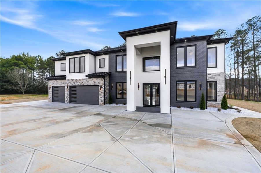 Front exterior of a new home in , Buford, GA, highlighting curb appeal (Image 31).