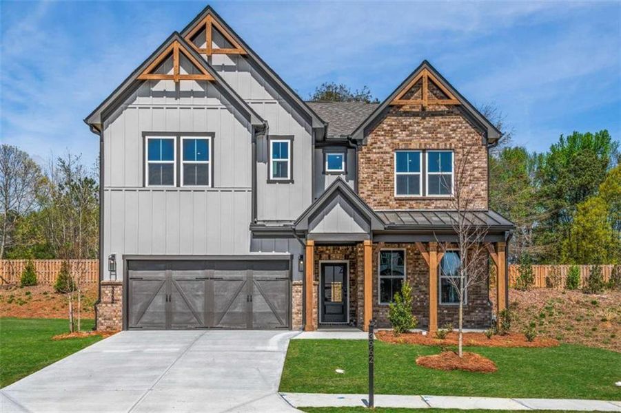 Front exterior of a new home in The Paddocks at Doc Hughes, Buford, GA, highlighting curb appeal (Image 30).