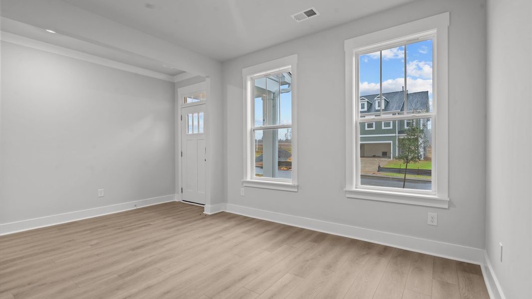 Top-notch design defines this flex room with hardwood floors and an open, airy layout Top-notch design defines this flex room with hardwood floors and an open, airy layout