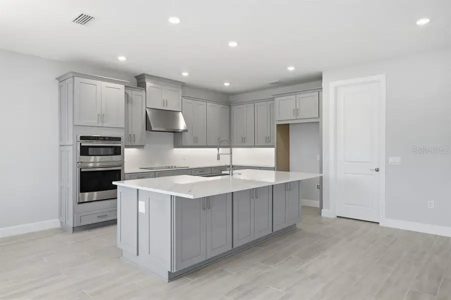 Furnished interior view inside a new home in Esplanade at Westview, Kissimmee (Image 9).