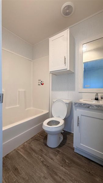 A well-maintained bathroom with a sleek vanity and a tub-shower combination. A well-maintained bathroom with a sleek vanity and a tub-shower combination.