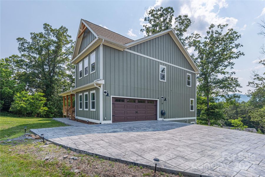 Front exterior of a new home in , Candler, NC, highlighting curb appeal (Image 25).
