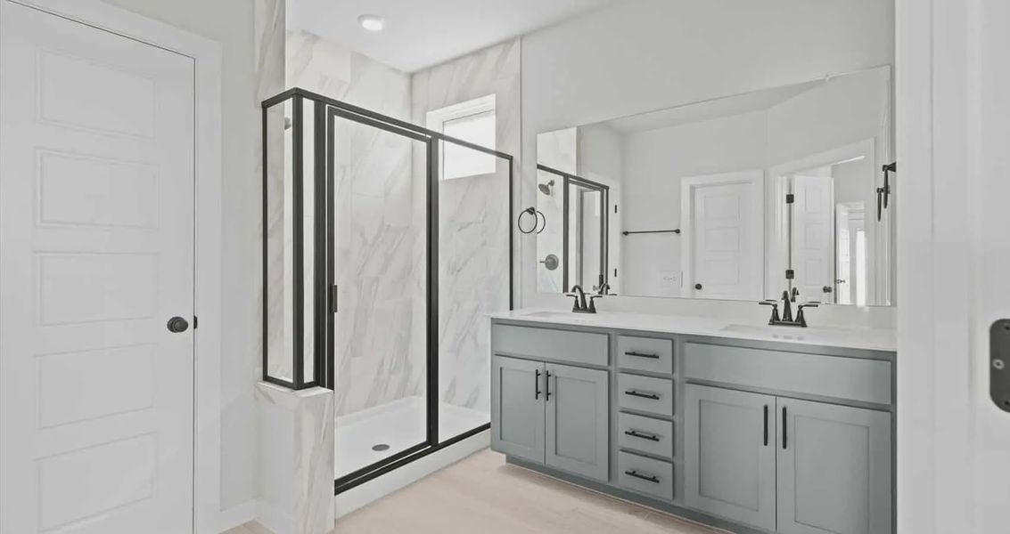 Representative furnished interior of a home built from the Avril by Chesmar Homes in Trace, New Caney (Image 6).