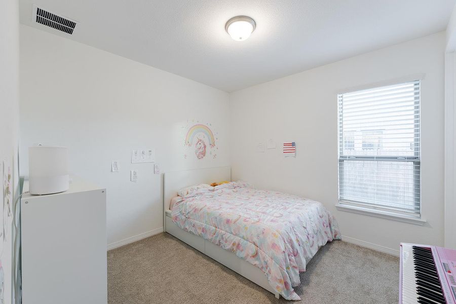 Bedroom with carpet flooring