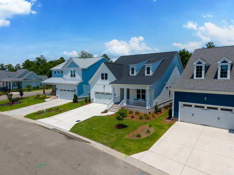 Front exterior of a new home in Sunset Reach, Castle Hayne, NC, highlighting curb appeal (Image 27).