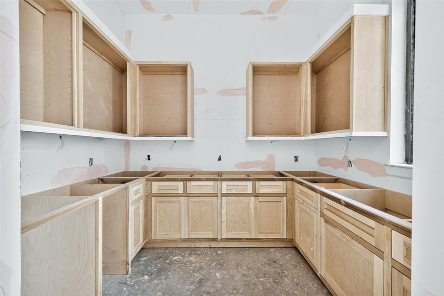 Butler's wet bar connected to the dining room with ample storage and counter space
