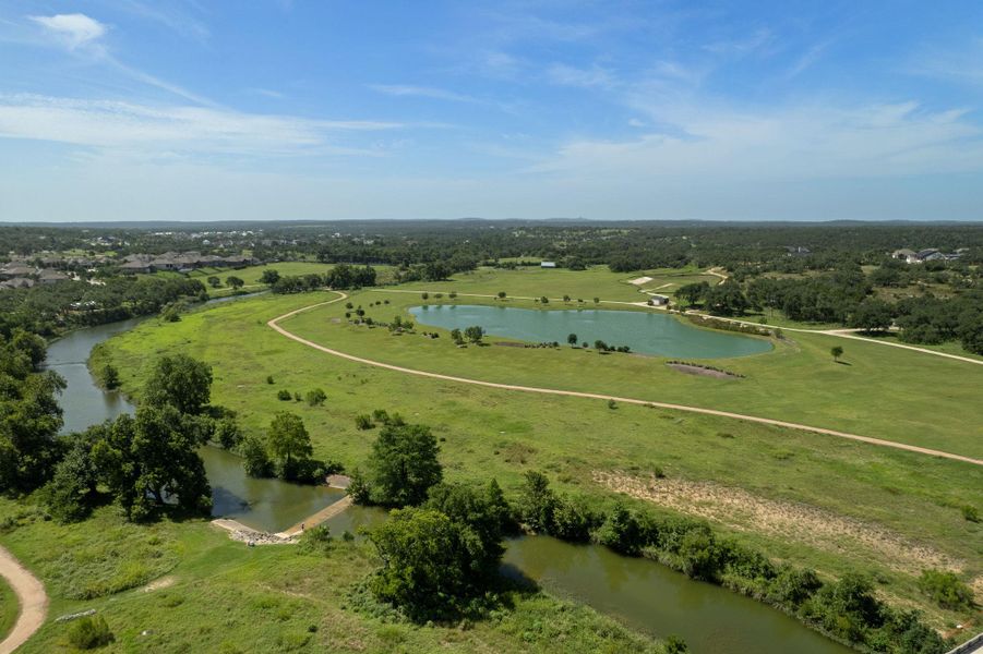 Aerial overview of property's location featuring a large body of water and a tree filled landscape Aerial overview of property's location featuring a large body of water and a tree filled landscape
