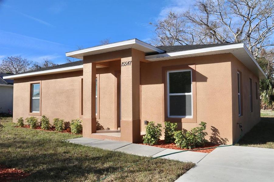 Front exterior of a new home in , Hudson, FL, highlighting curb appeal (Image 29). Front exterior of a new home in , Hudson, FL, highlighting curb appeal (Image 29).