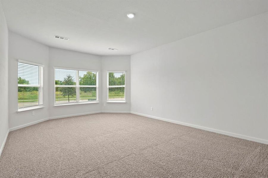 Unfurnished room featuring carpet floors and baseboards