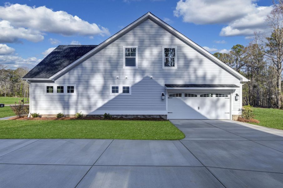 Front exterior of a new home in Clubside Reserve at Summerlake, Lexington, SC, highlighting curb appeal (Image 27). Front exterior of a new home in Clubside Reserve at Summerlake, Lexington, SC, highlighting curb appeal (Image 27).