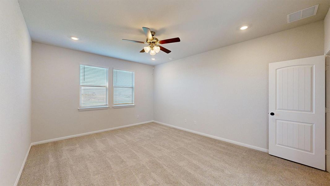 Spare room with light carpet, recessed lighting, and a ceiling fan